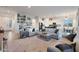 Open-concept living area with gray sofas and a view into the kitchen and dining area at 16041 E Duane Ln, Scottsdale, AZ 85262