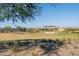 Landscaped community lawn with shaded seating area at 16731 S 181St Ave, Goodyear, AZ 85338