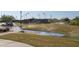 Community lawn with irrigation system and pathway at 16731 S 181St Ave, Goodyear, AZ 85338