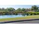 Scenic pond with lush landscaping in Cantamia community at 16731 S 181St Ave, Goodyear, AZ 85338