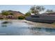 Serene pond at the CantaMia community entrance at 16731 S 181St Ave, Goodyear, AZ 85338