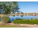 Serene lake view with community homes in background at 16731 S 181St Ave, Goodyear, AZ 85338