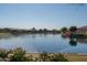 Calm lake with homes and lush foliage at 16731 S 181St Ave, Goodyear, AZ 85338