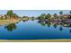 Serene lake reflecting surrounding homes at 16731 S 181St Ave, Goodyear, AZ 85338