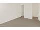 Bedroom with neutral carpet that seamlessly connect to the bathroom and walk-in closet providing a complete living space at 22507 W Pontiac Dr, Surprise, AZ 85387
