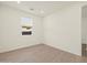 Well-lit bedroom has wood-look floor at 22507 W Pontiac Dr, Surprise, AZ 85387