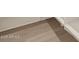 Detail of the stylish wood-look tile flooring complementing the modern interior design at 22507 W Pontiac Dr, Surprise, AZ 85387