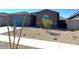 Attractive single-story house with desert landscaping, a two-car garage, and an inviting entrance at 22507 W Pontiac Dr, Surprise, AZ 85387