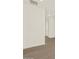 Hallway and doorway with wood-look flooring and white walls at 22507 W Pontiac Dr, Surprise, AZ 85387