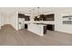 Modern kitchen featuring an island, pendant lights, stainless steel appliances, and cabinetry at 22507 W Pontiac Dr, Surprise, AZ 85387