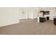 Spacious area features hardwood floors connecting the living room to the kitchen at 22507 W Pontiac Dr, Surprise, AZ 85387
