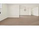 Large living room showcasing hardwood floors, a pendant light fixture, and ample space at 22507 W Pontiac Dr, Surprise, AZ 85387