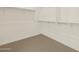 Spacious walk-in closet with ample shelving and storage, designed for organization and convenience at 22507 W Pontiac Dr, Surprise, AZ 85387
