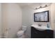 Simple bathroom with toilet, sink, and vanity at 3206 W Garfield St, Phoenix, AZ 85009