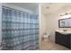 Clean bathroom with shower/tub combo, vanity, and tiled floor at 3206 W Garfield St, Phoenix, AZ 85009