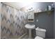 Clean bathroom with pedestal sink and shower/tub combo at 3206 W Garfield St, Phoenix, AZ 85009