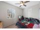 Bright bedroom with a double bed and ceiling fan at 3206 W Garfield St, Phoenix, AZ 85009