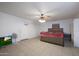 Spacious bedroom with ceiling fan, tiled floors, and a double bed at 3206 W Garfield St, Phoenix, AZ 85009