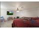 Large bedroom with ceiling fan, tiled floors, and a double bed at 3206 W Garfield St, Phoenix, AZ 85009