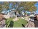 Charming home with a spacious front yard, featuring a fountain and a hammock at 3206 W Garfield St, Phoenix, AZ 85009