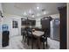 Kitchen with dark brown cabinets and a stainless steel refrigerator at 3206 W Garfield St, Phoenix, AZ 85009