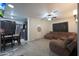 Living room with brown sectional sofa and adjacent kitchen at 3206 W Garfield St, Phoenix, AZ 85009