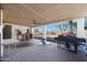 Covered patio with brick flooring and built-in grill at 3206 W Garfield St, Phoenix, AZ 85009