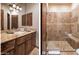 Bathroom with granite countertop and walk in shower at 7624 E Stagecoach Pass, Carefree, AZ 85377