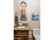 Stylish bathroom with granite countertop, modern vanity, and mid-century modern art at 7624 E Stagecoach Pass, Carefree, AZ 85377