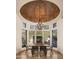 Elegant dining room with a chandelier and large windows at 7624 E Stagecoach Pass, Carefree, AZ 85377