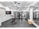 Home gym with a variety of exercise equipment, including a stationary bike and weights at 7624 E Stagecoach Pass, Carefree, AZ 85377