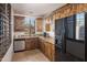 Kitchen with wood cabinets, granite countertops, and stainless steel appliances at 7624 E Stagecoach Pass, Carefree, AZ 85377