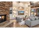 Open living space with a built-in entertainment center and fireplace at 7624 E Stagecoach Pass, Carefree, AZ 85377