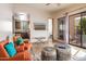 Open living space with orange armchairs and view into kitchen at 7624 E Stagecoach Pass, Carefree, AZ 85377