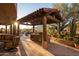Covered patio with built-in outdoor kitchen and grill at 7624 E Stagecoach Pass, Carefree, AZ 85377