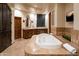 Primary bathroom with large soaking tub and double vanity at 7624 E Stagecoach Pass, Carefree, AZ 85377