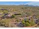 Aerial view of the home and grounds, highlighting the pool and patio area at 8505 E Morning Vista Rd, Scottsdale, AZ 85266