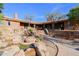 Backyard with a stone pathway leading to the house and pool area at 8505 E Morning Vista Rd, Scottsdale, AZ 85266