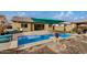 Modern pool with comfortable seating and a beautiful backyard at 10241 E Ampere Ave, Mesa, AZ 85212