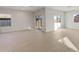 Bright living room with tile floors and sliding glass doors at 17819 W Encinas Ln, Goodyear, AZ 85338