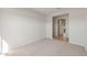 Spacious bedroom with carpet flooring and access to a hallway at 17867 W Encinas Ln, Goodyear, AZ 85338