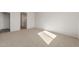 Bright bedroom with carpet flooring and an ensuite bathroom at 17867 W Encinas Ln, Goodyear, AZ 85338