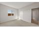 Well-lit bedroom featuring carpet and a sliding door closet at 17867 W Encinas Ln, Goodyear, AZ 85338