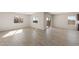 Bright dining room with tile floors and an open floor plan at 17867 W Encinas Ln, Goodyear, AZ 85338