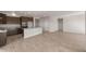 Open and airy living room with tile floors and lots of natural light at 17867 W Encinas Ln, Goodyear, AZ 85338