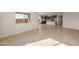 Spacious living room with tile floors and an open floor plan at 17867 W Encinas Ln, Goodyear, AZ 85338