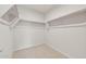 Large walk-in closet with double hanging rods at 17867 W Encinas Ln, Goodyear, AZ 85338