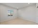 Bright bedroom with carpeted floor and window at 17869 W Getty Dr, Goodyear, AZ 85338