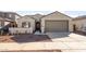 New single-story home with a two-car garage and desert landscaping at 17869 W Getty Dr, Goodyear, AZ 85338