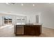 Open concept kitchen with island, stainless steel appliances and view to backyard at 17869 W Getty Dr, Goodyear, AZ 85338